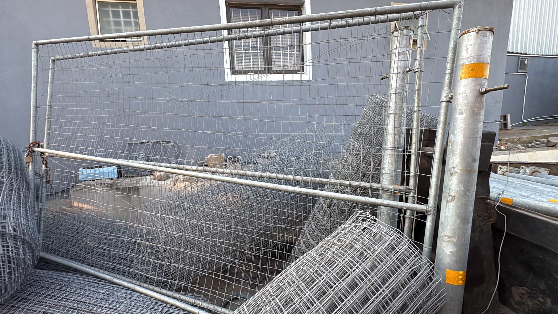 Large double steel gate with galvanized frame and wire mesh infill